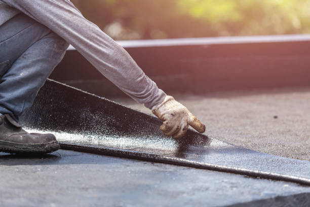 Professional Basement Waterproofing technician working in Newtown, IN